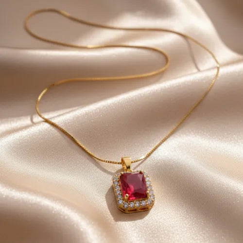 gold ruby color pendant necklace with emerald cut CZ stone and halo design