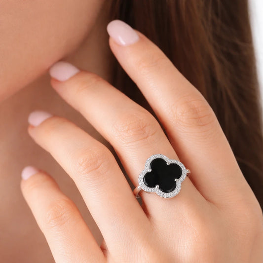Minimal black onyx clover halo ring in 925 silver with crystal halo detailing, elegant jewellery for modern women.