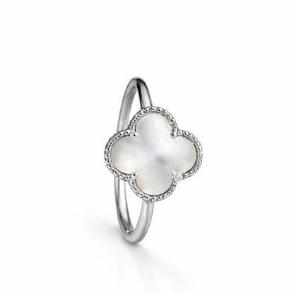 Mother of pearl clover halo ring in 925 sterling silver with sparkling stone border, elegant minimal jewellery for women.